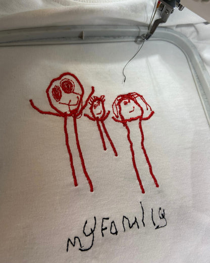 Kids drawing custom embroidery on a T-shirt