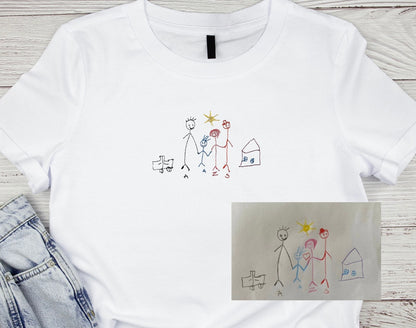 Kids drawing custom embroidery on a T-shirt