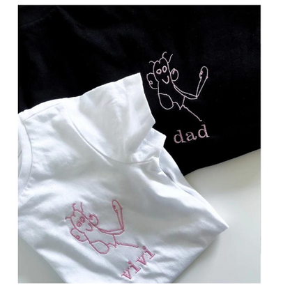 Kids drawing custom embroidery on a T-shirt