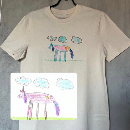 Kids drawing custom embroidery on a T-shirt