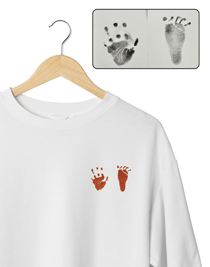 Kids drawing custom embroidery on a T-shirt